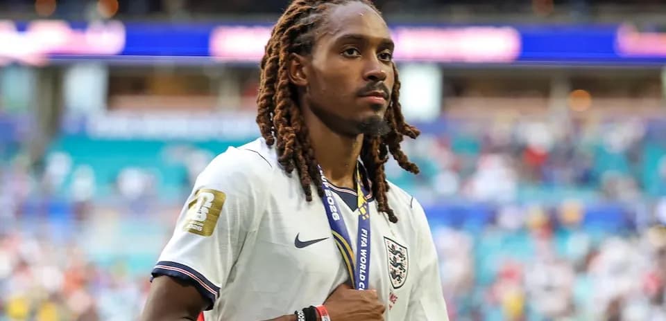 Player walking with medal after match