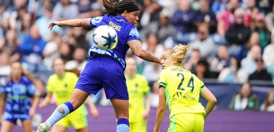Player competing for the ball during NWSL match