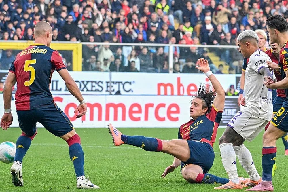 Genoa player falling during Fiorentina match