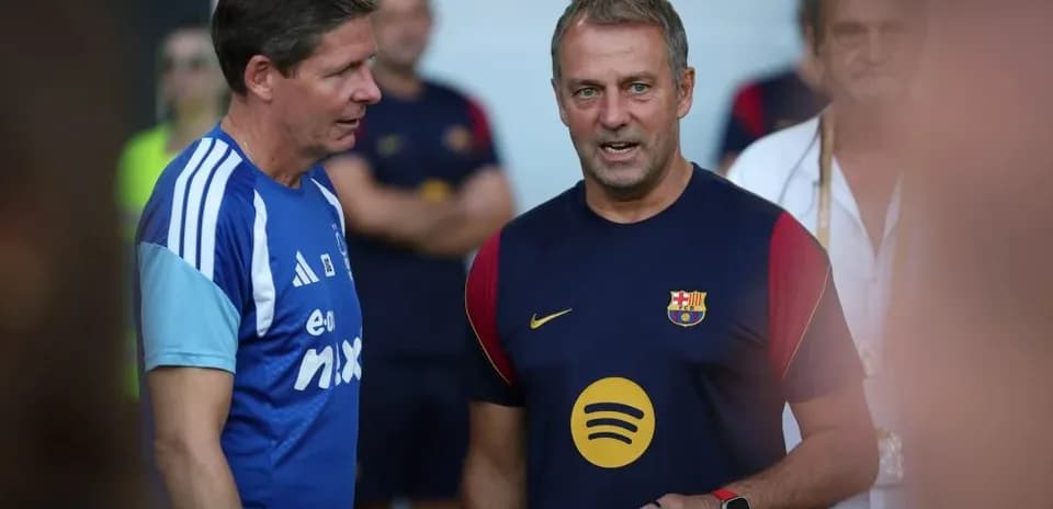 Two coaches discussing during training session