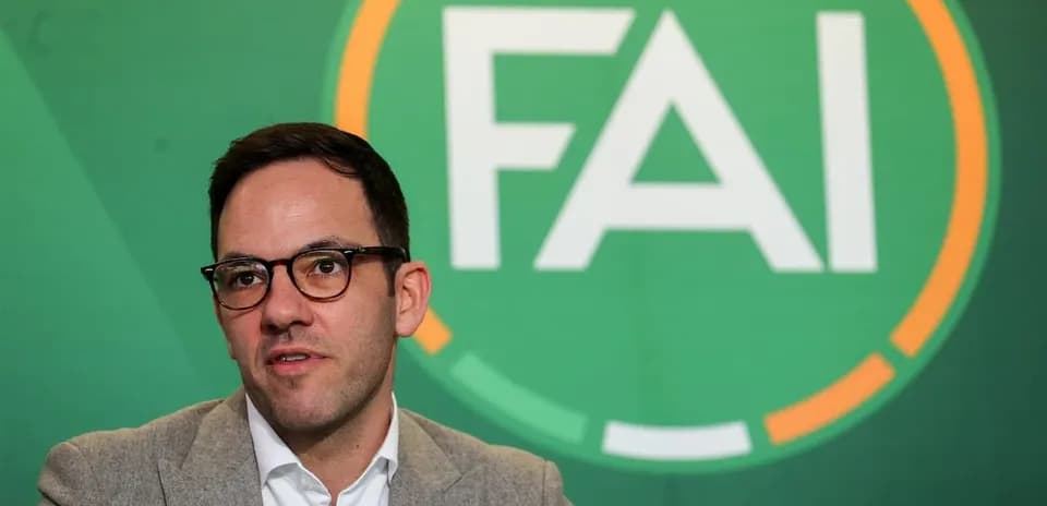 Official speaking at FAI press conference backdrop