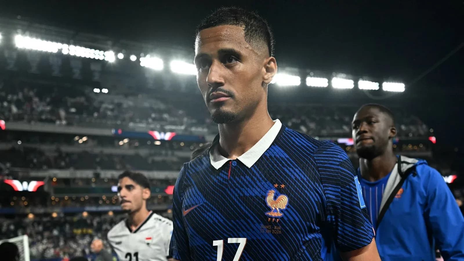 Player wearing France jersey walking off the field