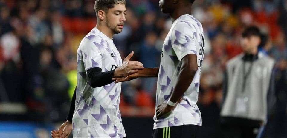 Two Real Madrid players interacting on the pitch