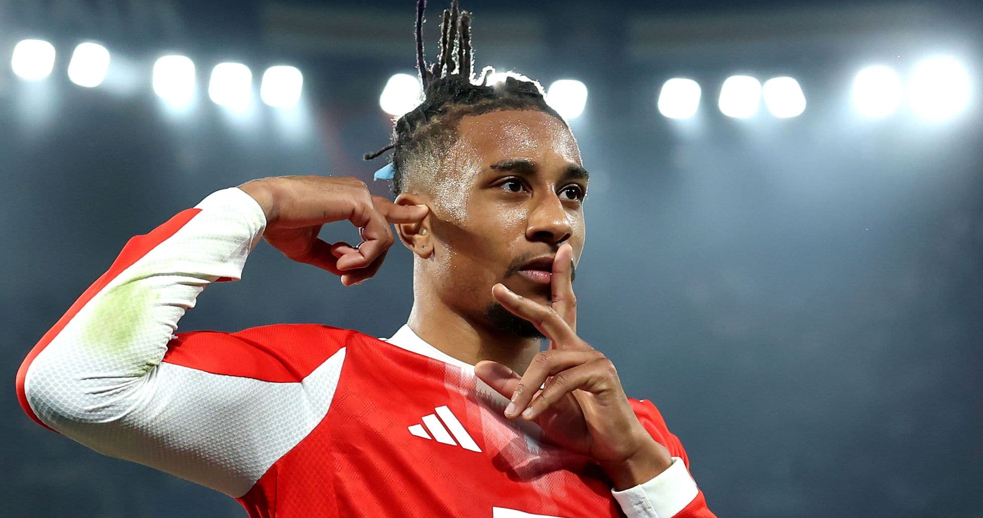 Player celebrating with a shushing gesture