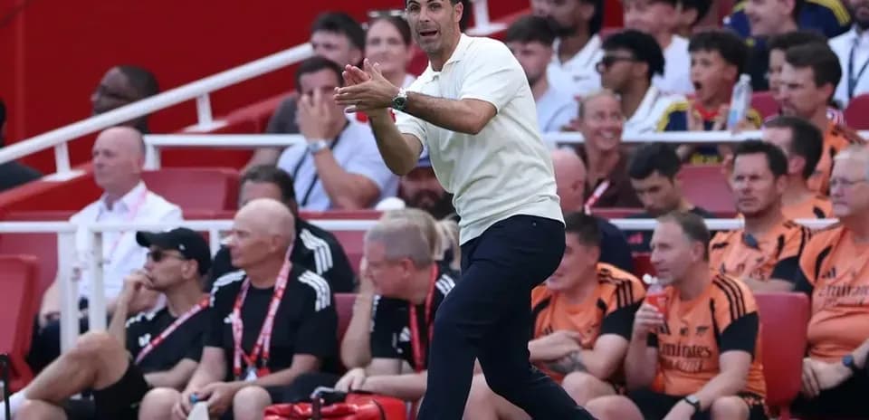 Manager giving instructions during match on sideline