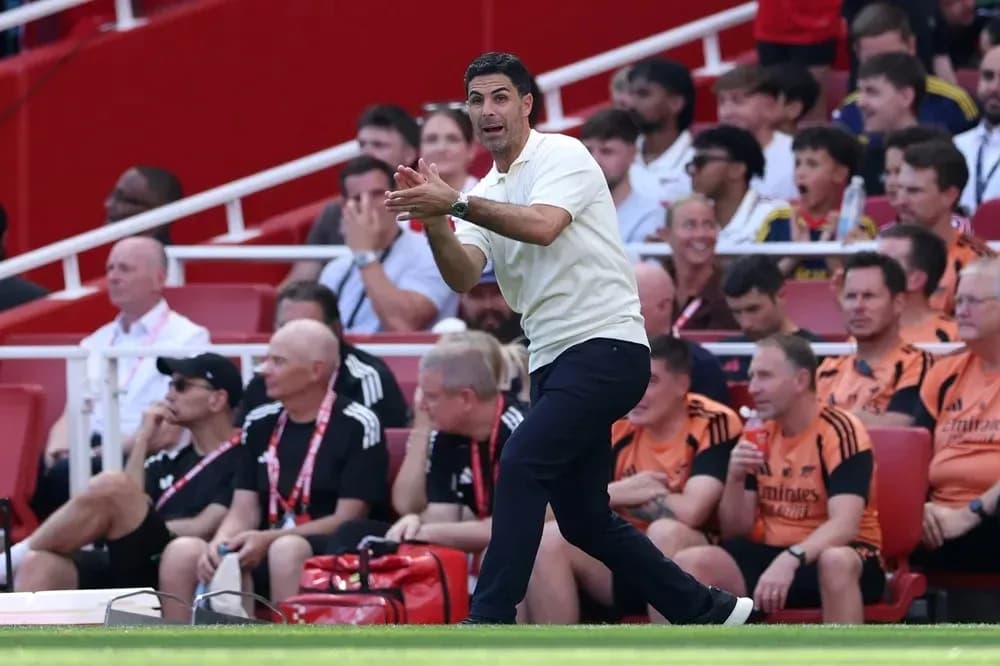 Manager giving instructions during match on sideline