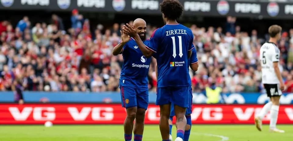 Two players celebrating during a football match