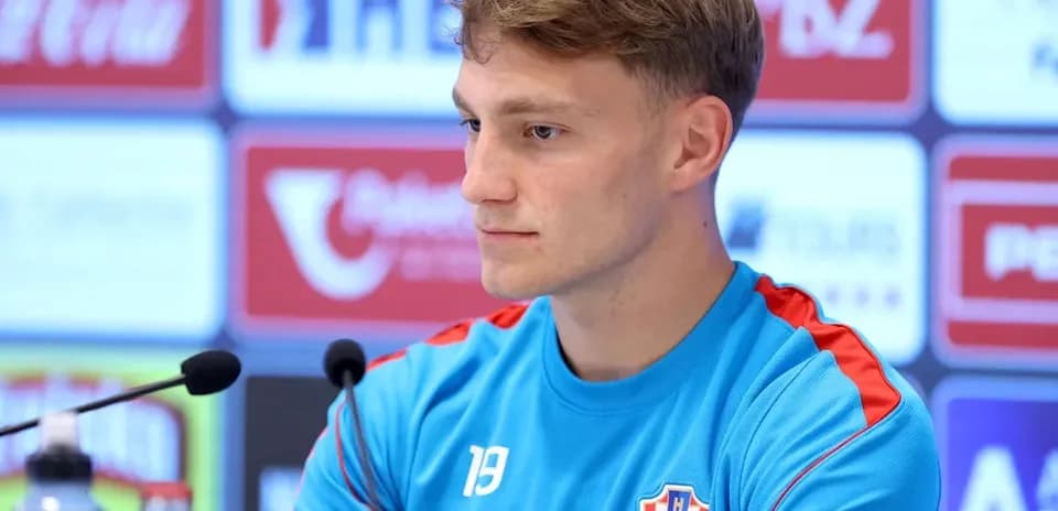 Player at press conference wearing Croatia training kit