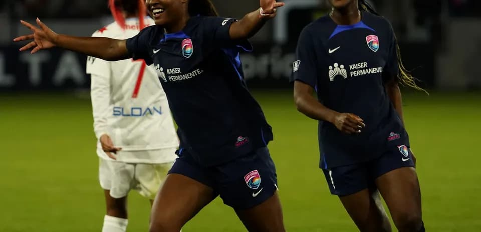 Players celebrating after scoring a goal