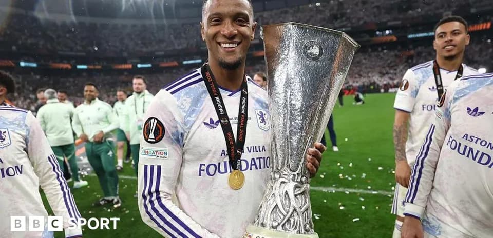 Player celebrating with UEFA Europa League trophy