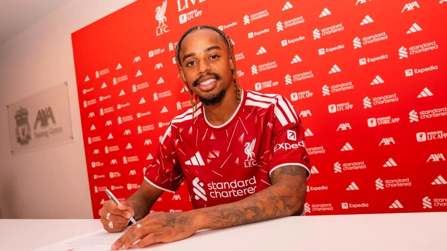 Player signing contract at Liverpool FC press event