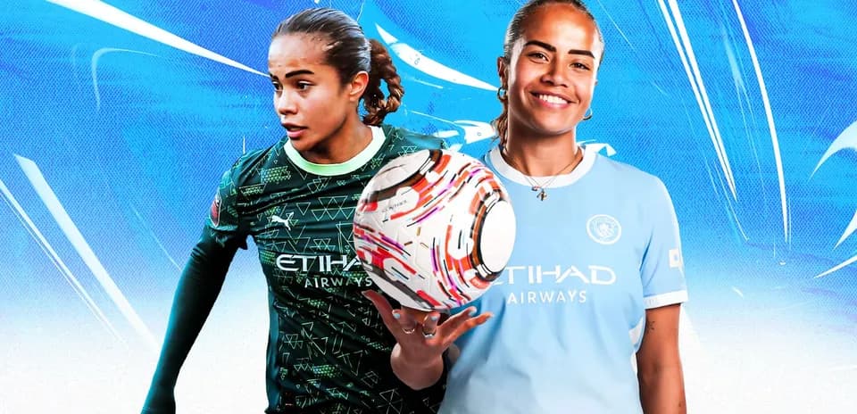 Two female soccer players in team jerseys posing
