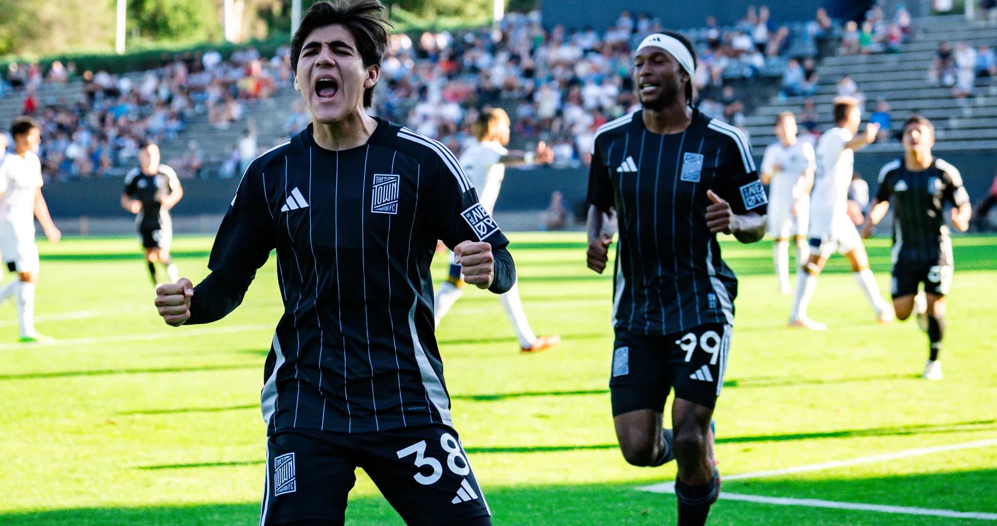 Players celebrating a goal during match