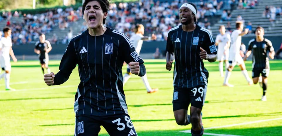 Players celebrating a goal during match