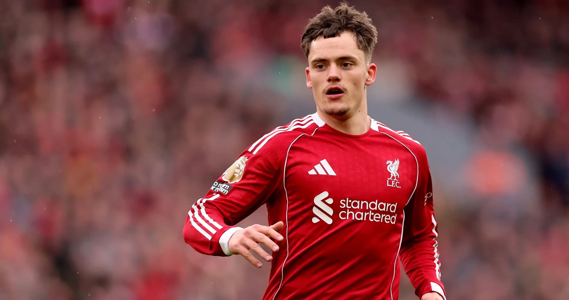 Liverpool player running on the pitch during match