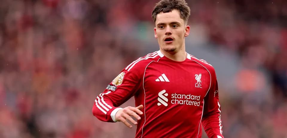 Liverpool player running on the pitch during match