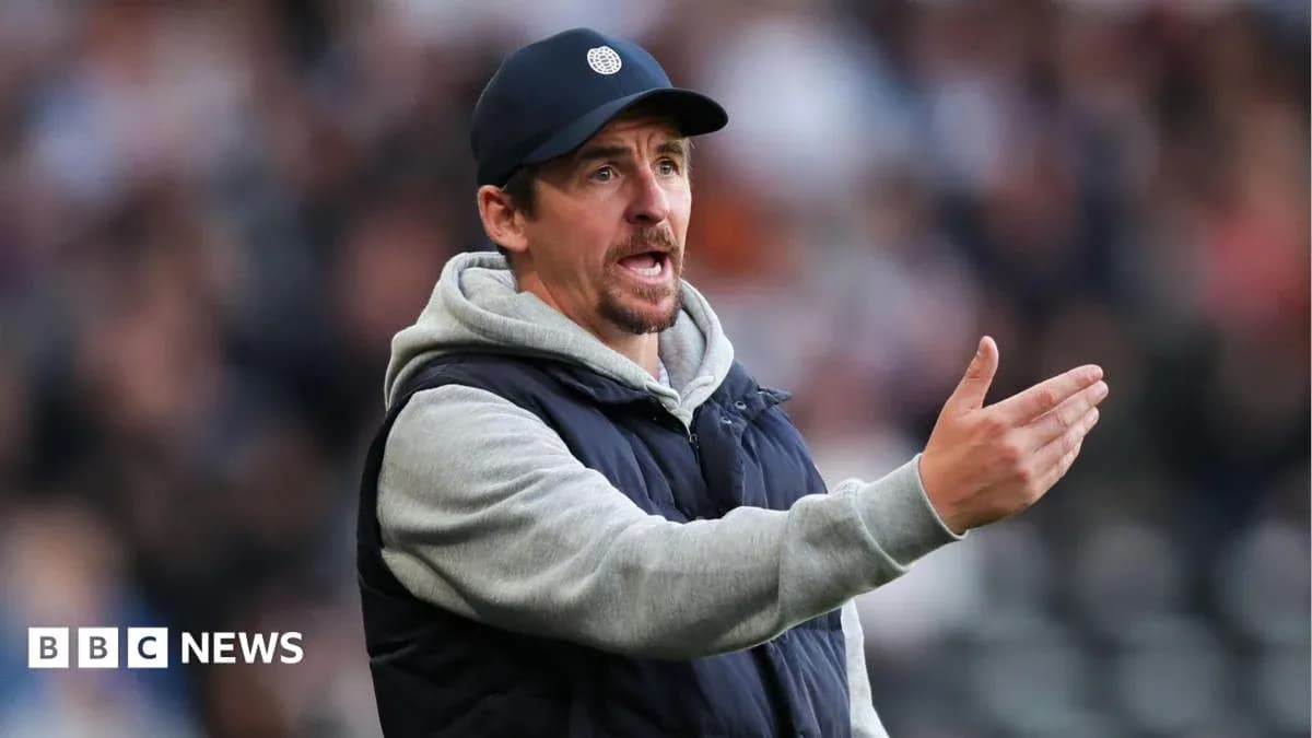 Coach gesturing during a match on the sidelines