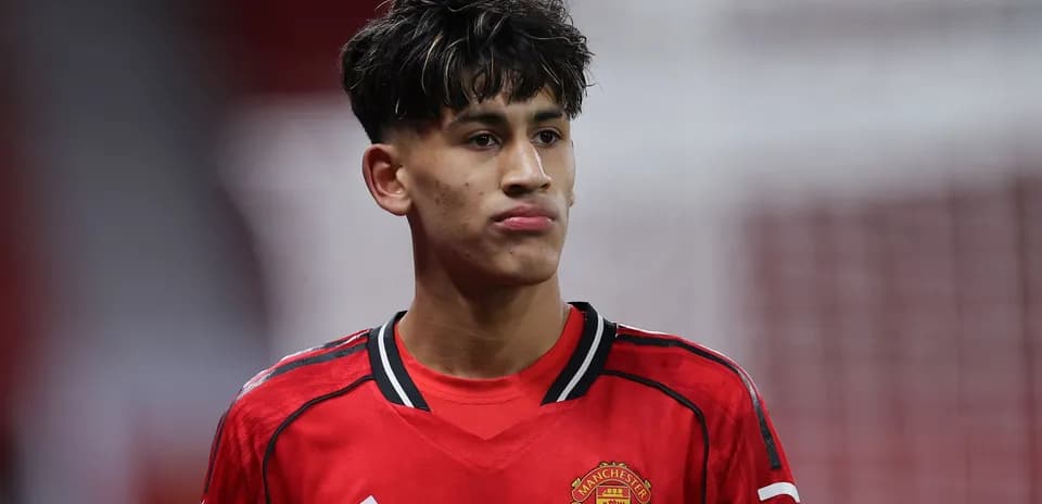 Player wearing Manchester United jersey on field