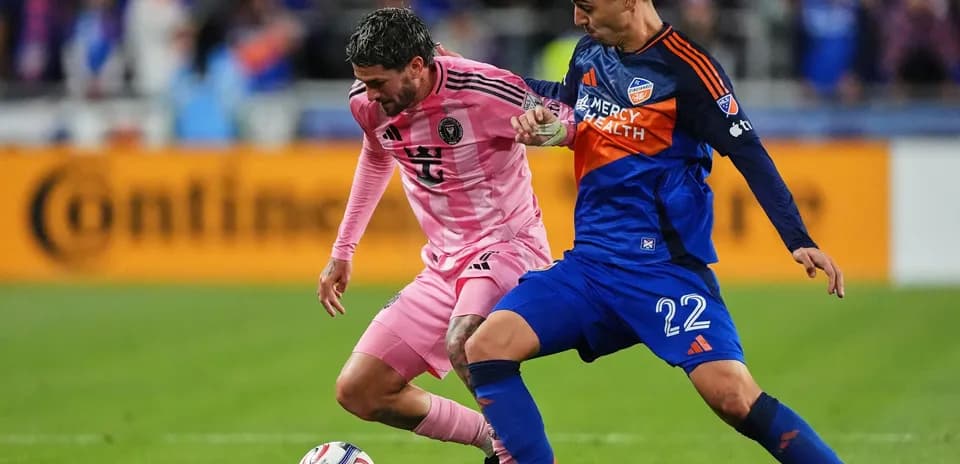 Players competing for the ball in MLS Next Pro match
