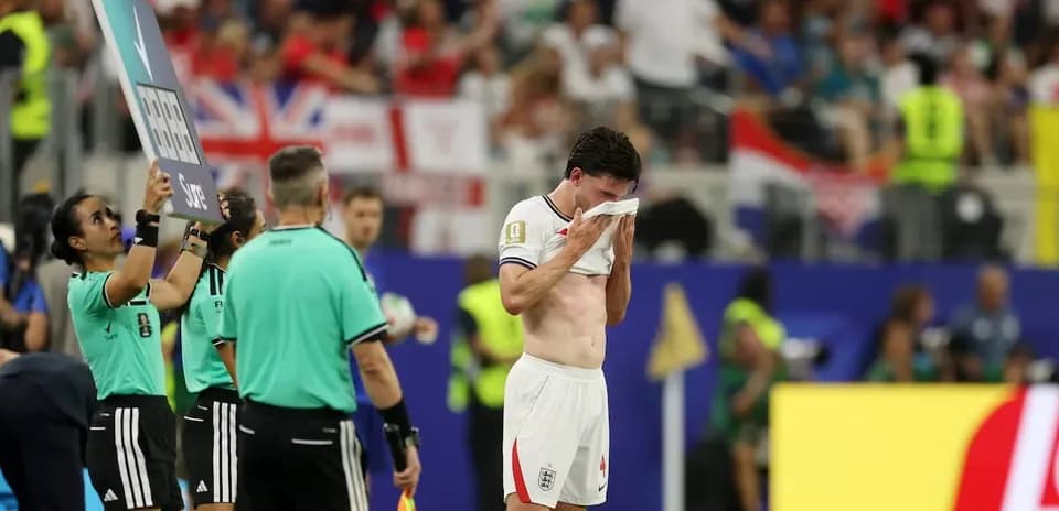Player wiping sweat during substitution in match