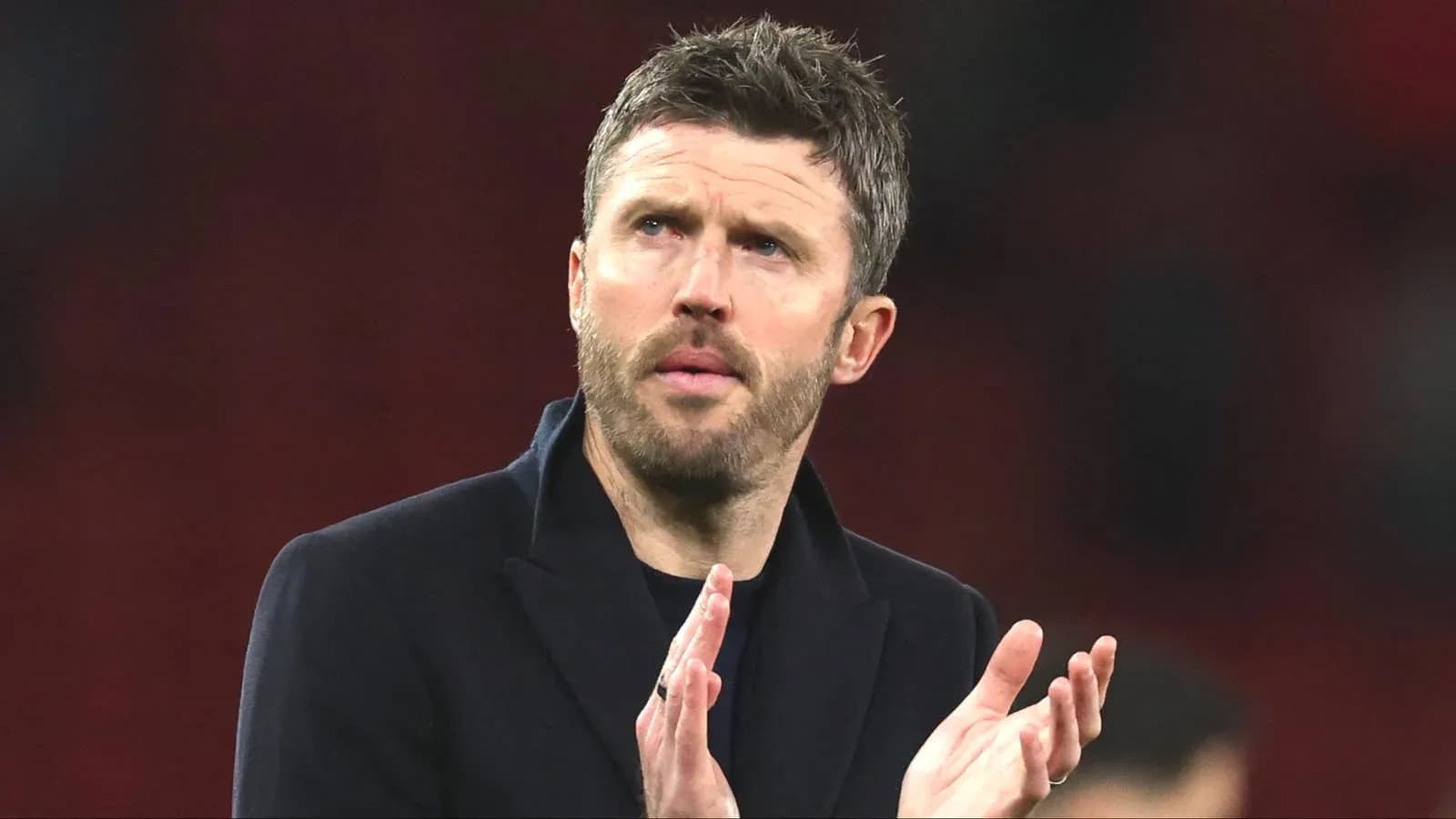 Manager applauding after a match conclusion