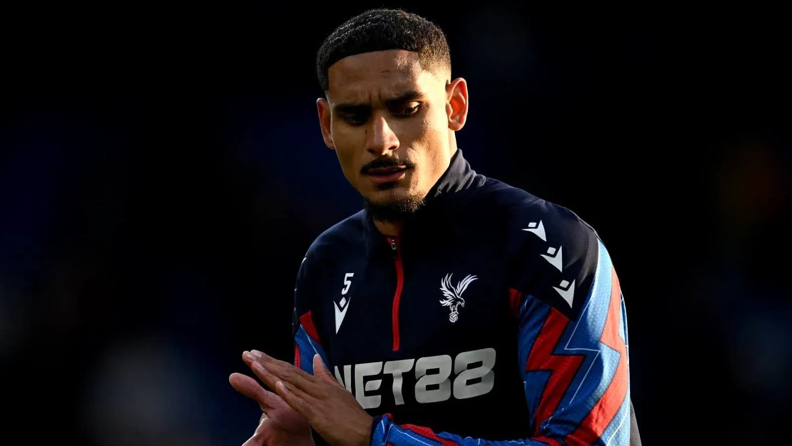 Player wearing Crystal Palace kit during warm-up