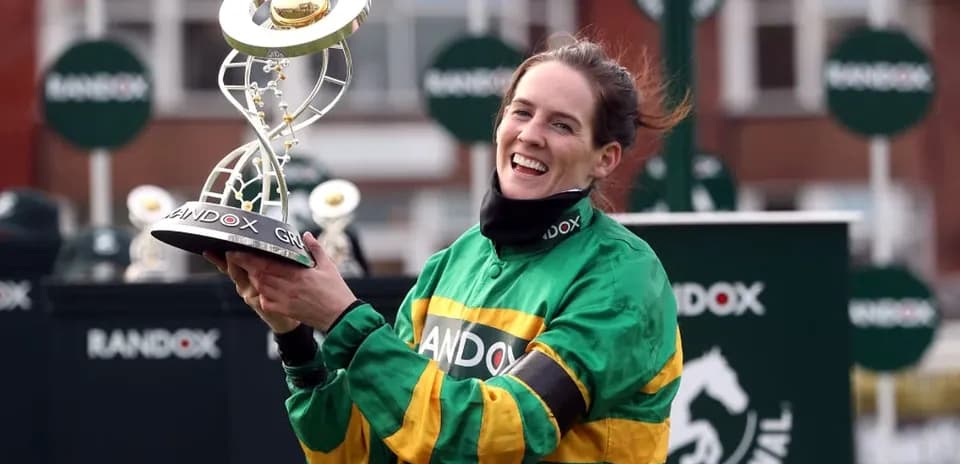 Jockey celebrating with trophy after winning race