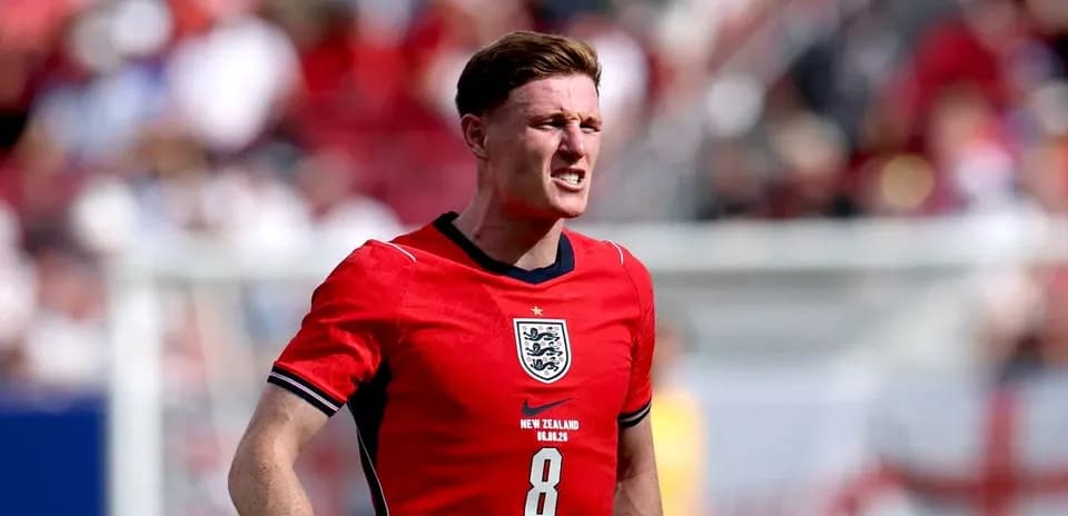 Player in red England jersey during match
