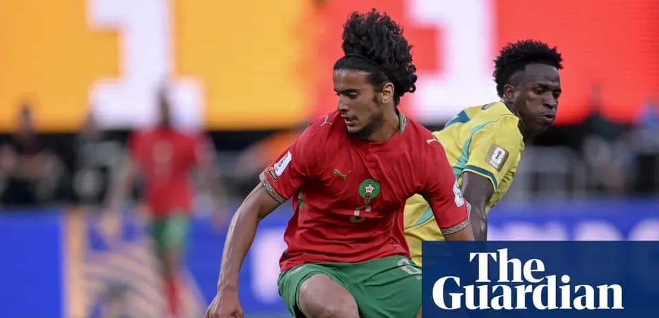 Morocco player dribbling past opponent during match