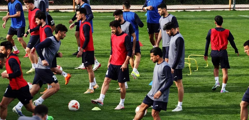 Players training on the pitch in practice session