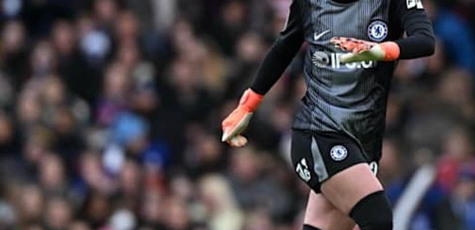 Goalkeeper in Chelsea kit during match action