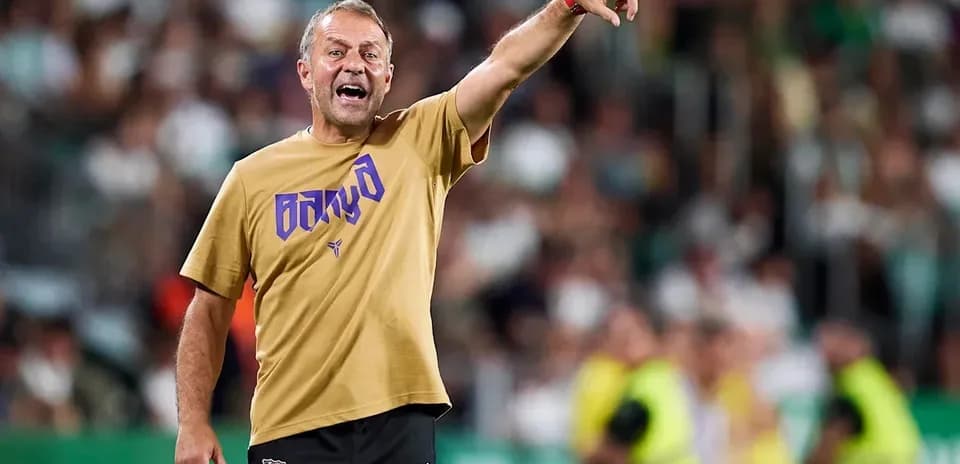 Coach gesturing from the sidelines during match