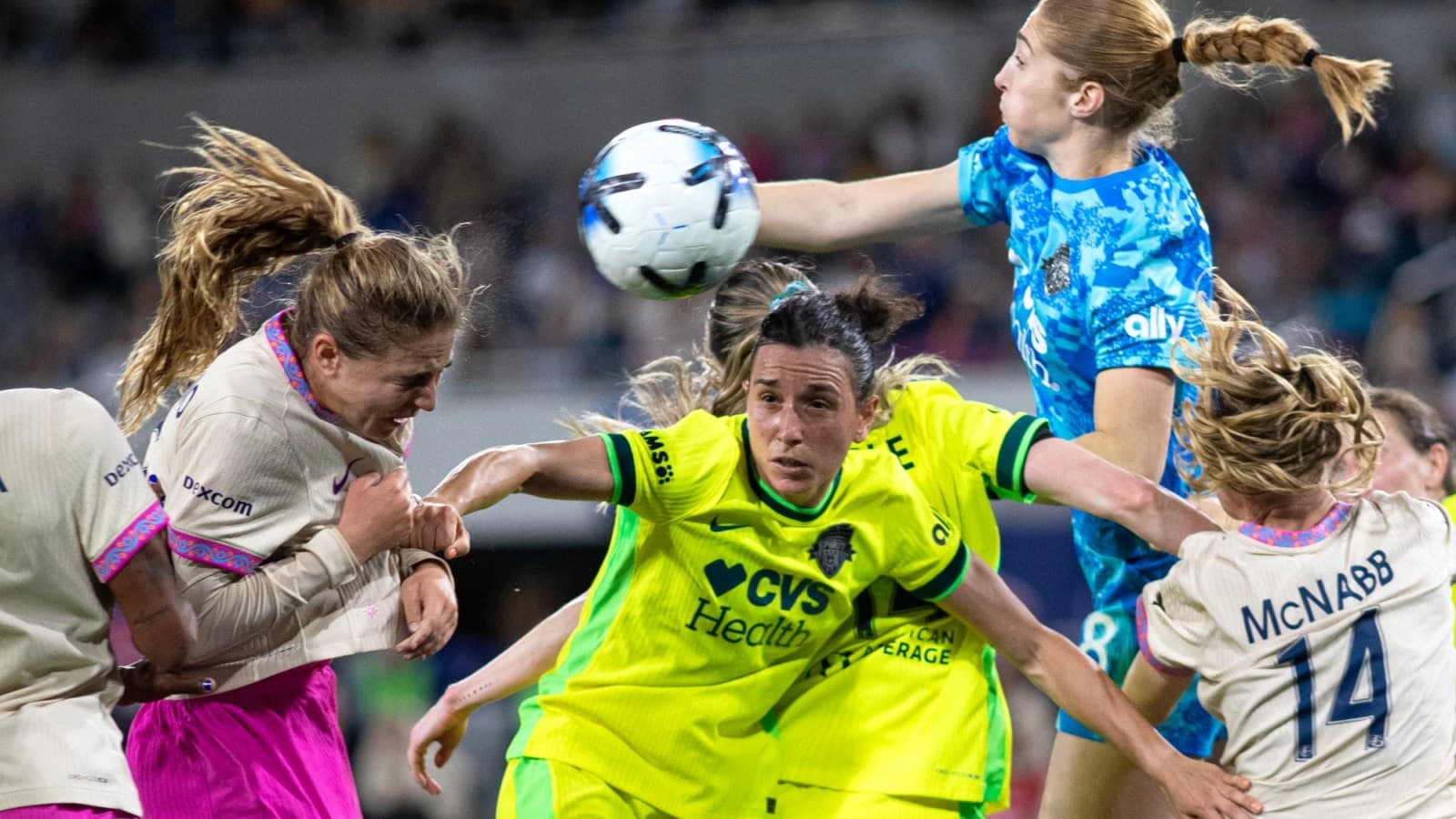 Players competing for the ball during match action