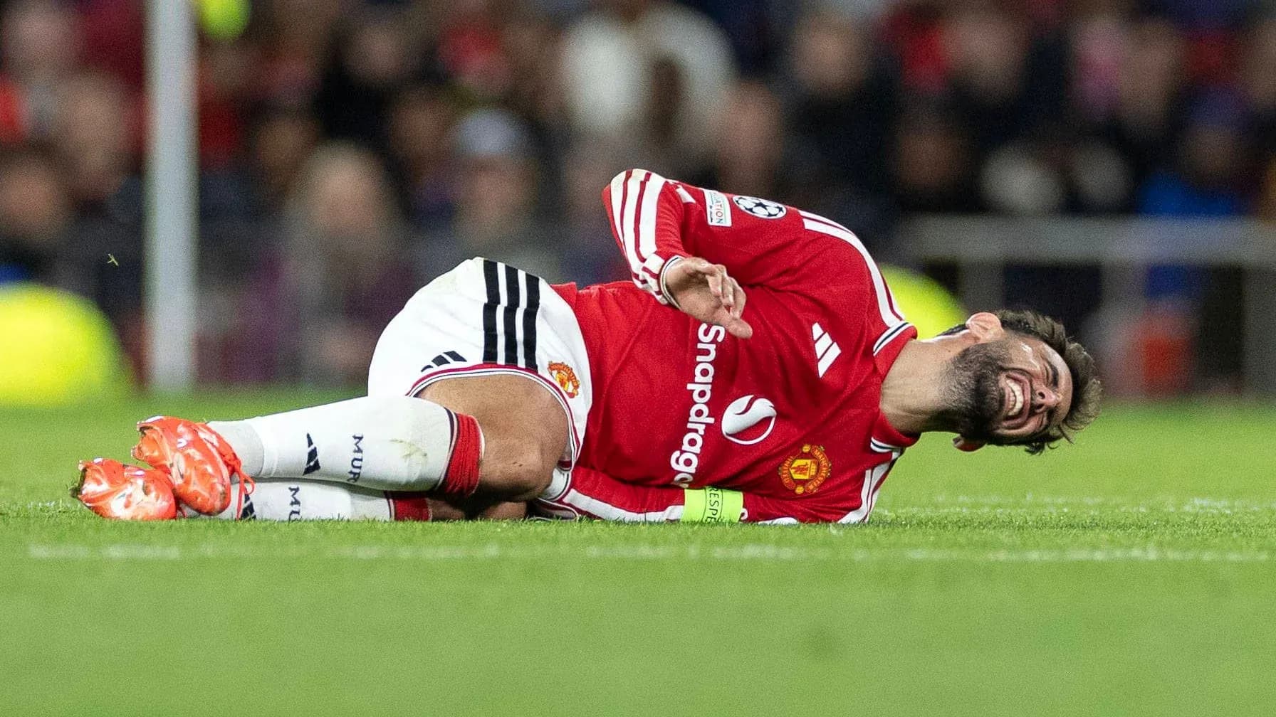 Player lying on the field in pain during match