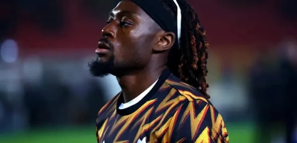 Football player in colorful jersey on field
