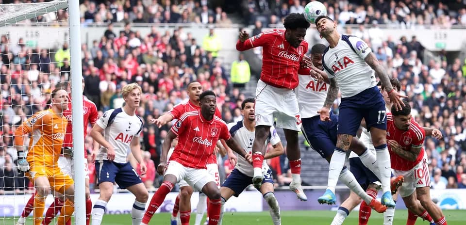 Players contesting a header during match action
