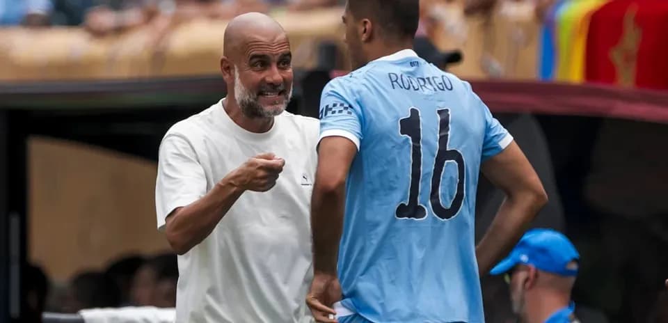 Manager speaking to player during match substitution