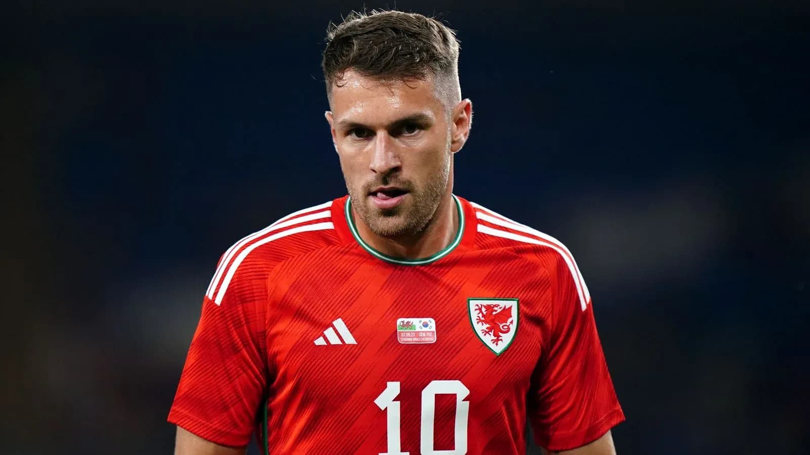Wales player wearing red jersey during match