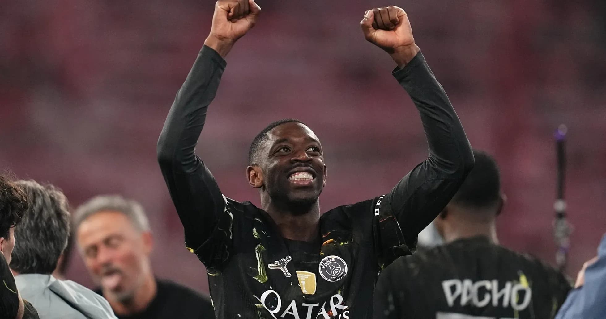 Player celebrating with raised arms after victory