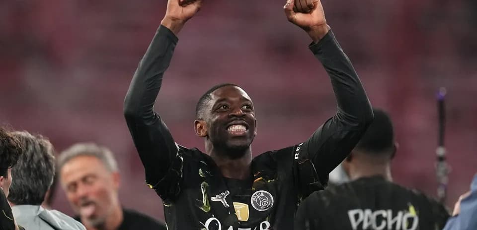Player celebrating with raised arms after victory