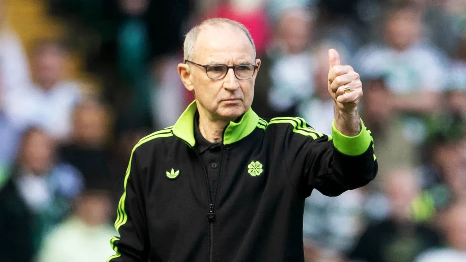 Coach giving thumbs up during match