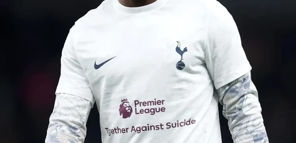 Player wearing Tottenham kit during warm-up session
