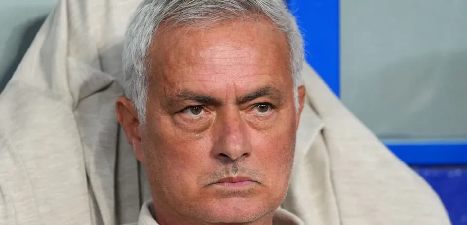 Coach sitting on bench during a match