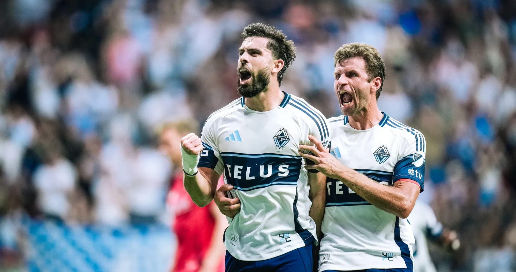 Vancouver Whitecaps players celebrating a goal