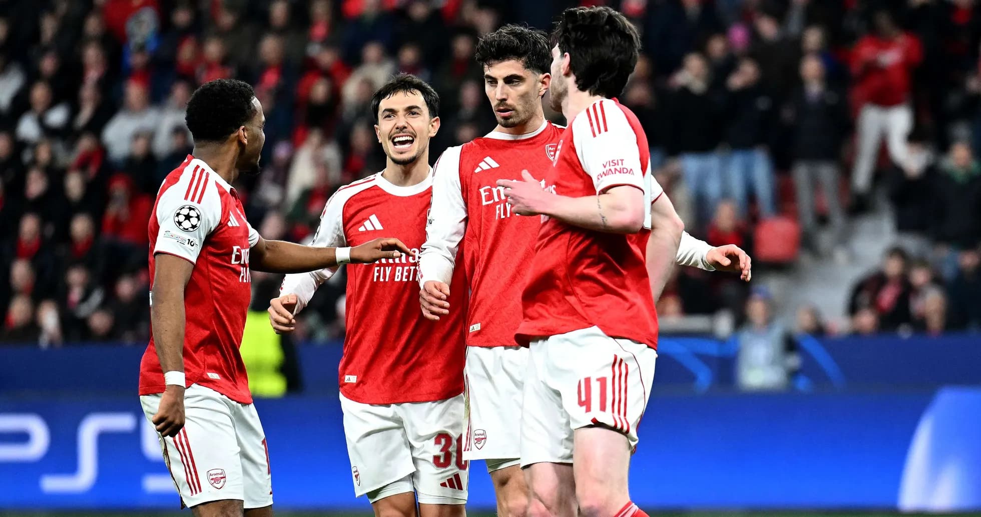 Arsenal players celebrating during UEFA Champions League match