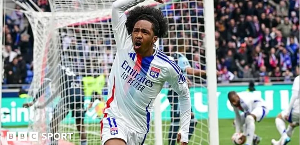 Player celebrating a goal in front of the goalpost