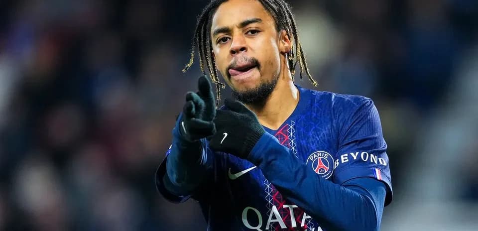 Player gesturing during match in PSG jersey