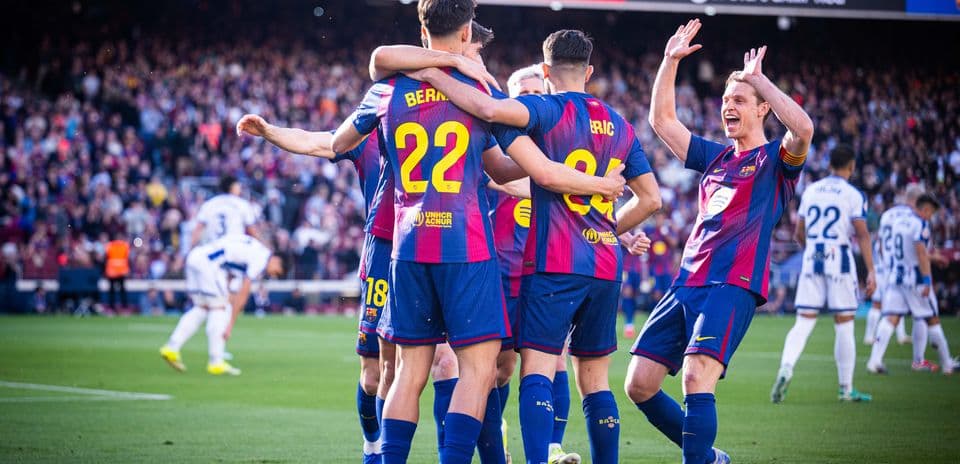 Barcelona players celebrating a goal during match