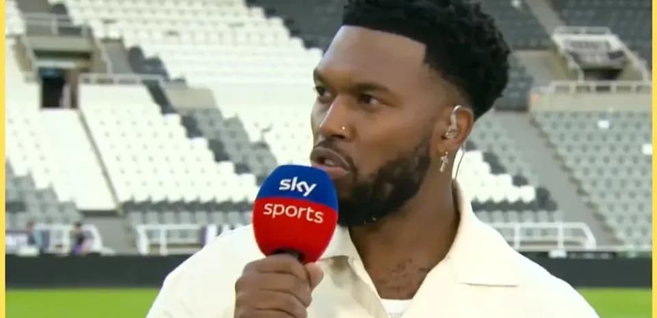 Presenter speaking into microphone on sports set