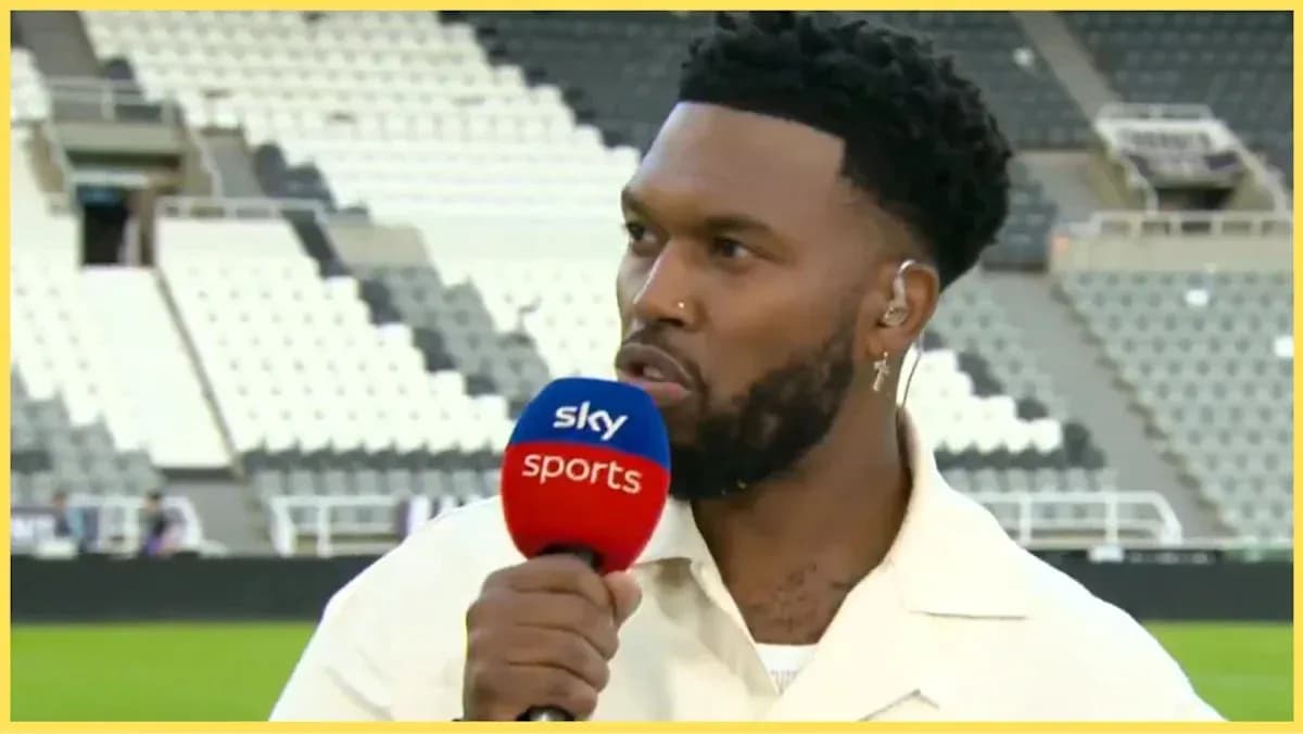 Presenter speaking into microphone on sports set